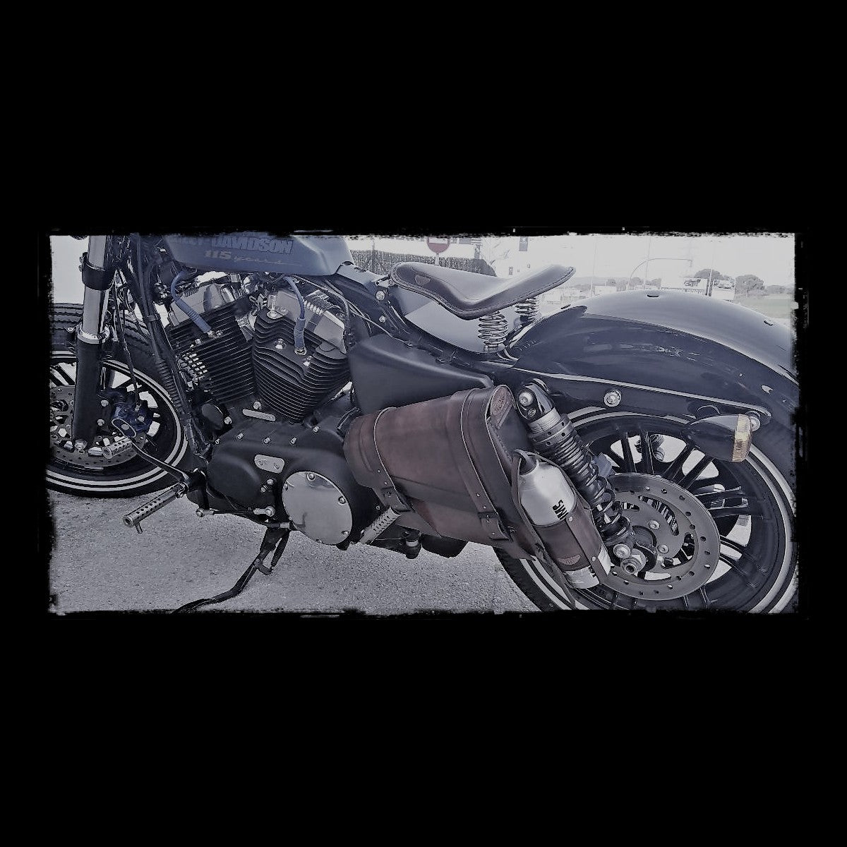 dhcustom vintage dark leather saddlebag with fuel bottle
